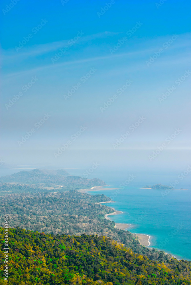 Panoramic view of the mountain tropical coast covered with rainforest