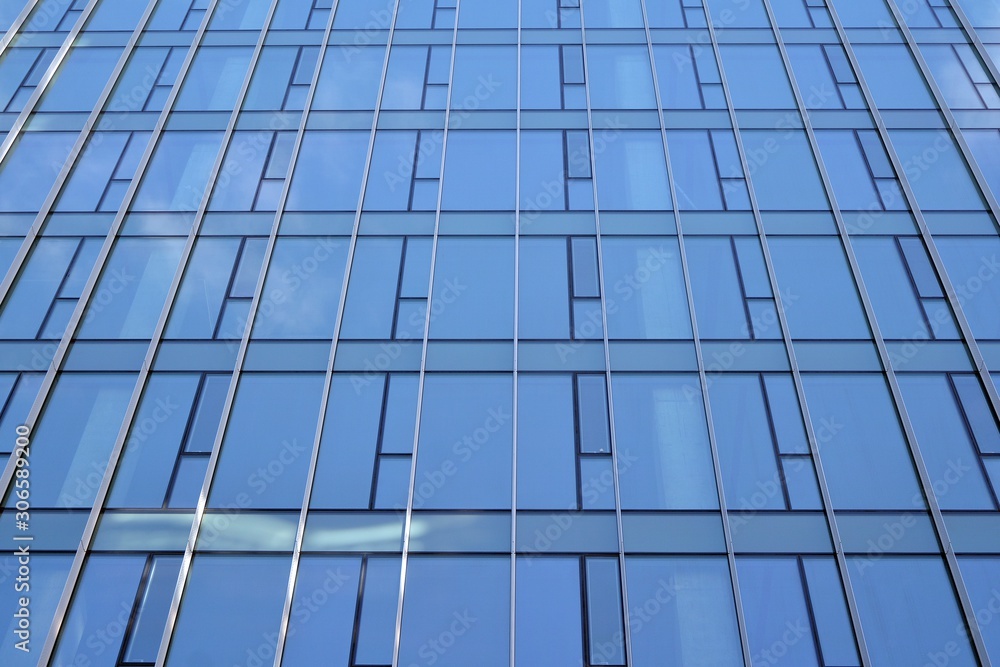 Abstract texture of blue glass modern building skyscrapers. Business background. Abstract texture of blue glass modern building skyscrapers. Business background.