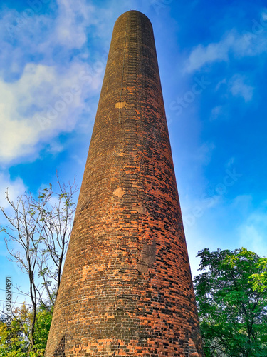 Old Brick Chimney and Blue Sky