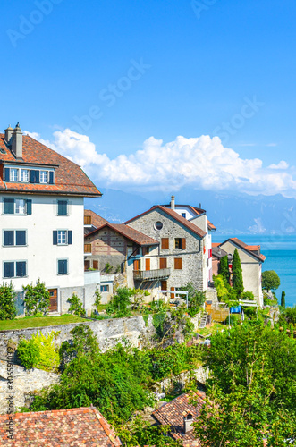 Beautiful winemaking village Rivaz in Swiss Lavaux wine region. Buildings located by the stunning Lake Geneva. Natural landscape in Switzerland. European travel destination