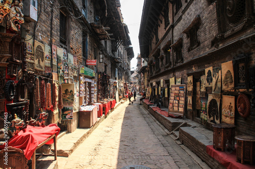 BHAKTAPUR, NEPAL - APRIL 22, 2014:The main attraction of Nepal is the city of Bhaktapur, destroyed by an earthquake. wooden carvings, painting and art of Nepal. UNESCO World Heritage. photo