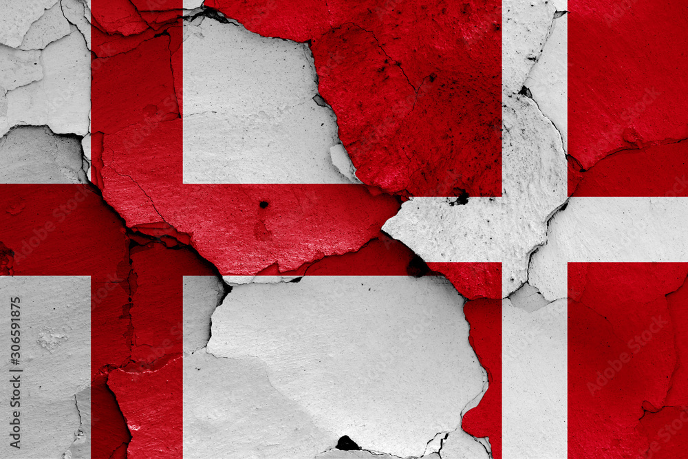 flags of England and Denmark painted on cracked wall