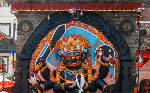 Kal Bhairav statue at Durbar Square in Kathmandu, Nepal. Hindu tantric deity worshiped by Hindus. In Shaivism, the brutal manifestation of Shiva associated with the destruction photo