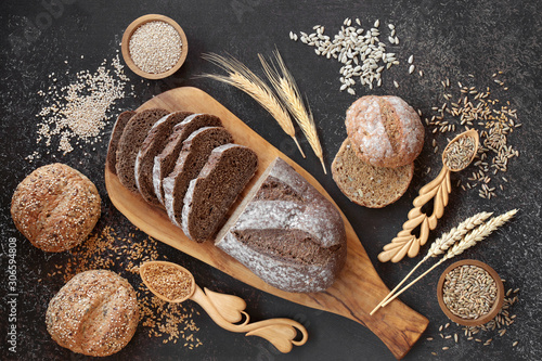 High fibre  rye bread loaf with sour dough & seeded rolls, loose grain & seeds. High in vitamins, antioxidants and omega 3. Reduces high blood pressure, cholesterol and optimise a healthy heart. photo