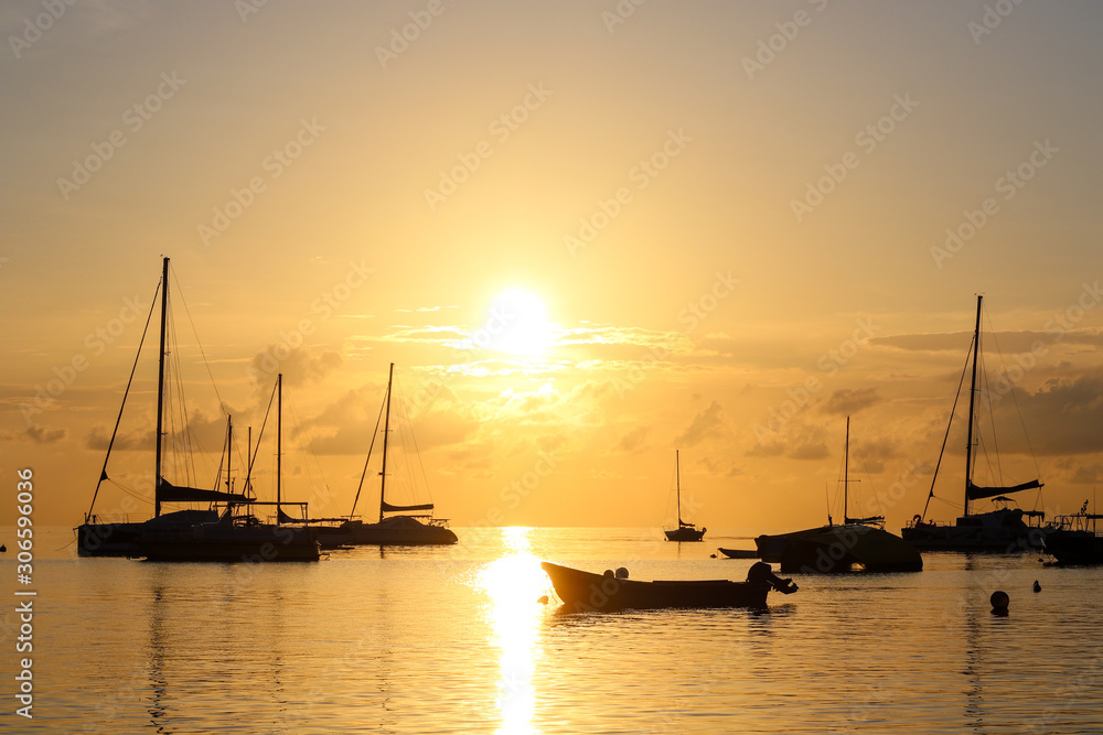 sunset on the sea with boats