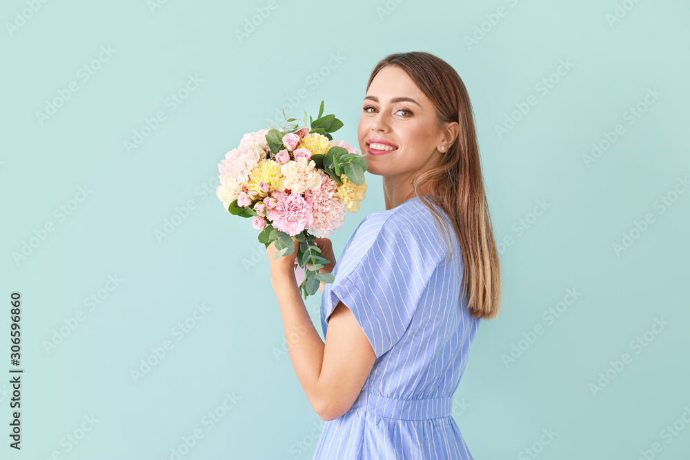 Beautiful young woman with bouquet of carnation flowers on color background Beautiful young woman with bouquet of carnation flowers on color background