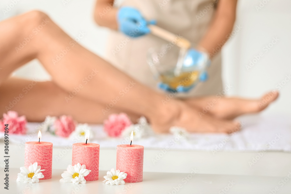Burning candles with flowers in beauty salon Burning candles with flowers in beauty salon