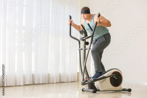Overweight man training at ...