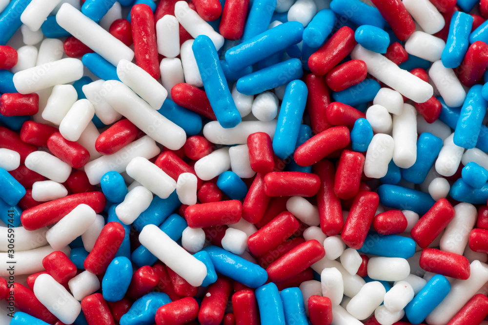 Red white and blue sprinkles close up view with random texture Stock