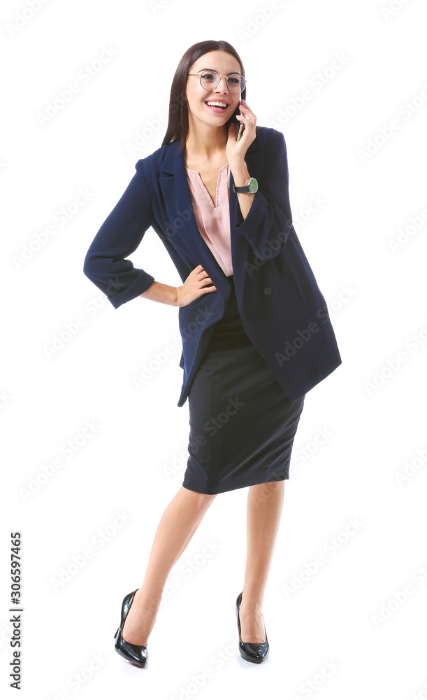 Beautiful young businesswoman talking by phone on white background Beautiful young businesswoman talking by phone on white background
