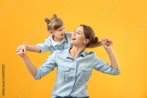 Portrait of happy mother an...