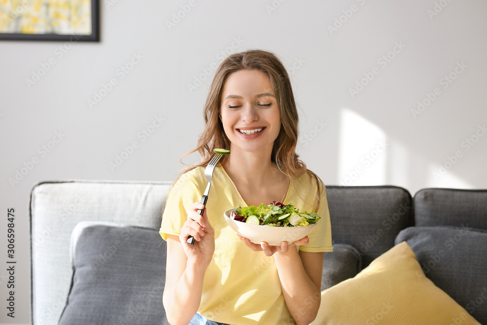 Woman eating healthy vegetable salad at home Woman eating healthy vegetable salad at home