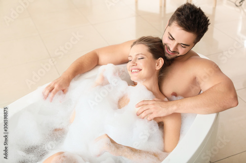 Happy young couple taking b...
