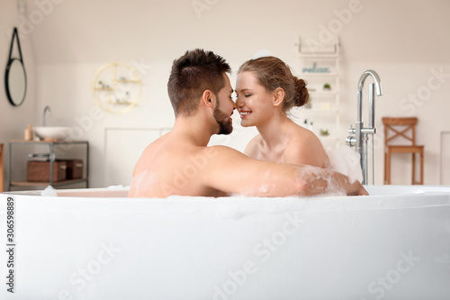 Happy young couple taking b...