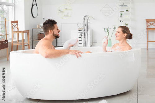 Happy young couple taking b...