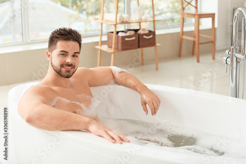 Handsome young man taking b...