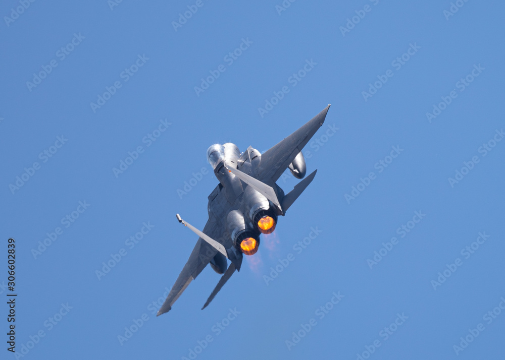F-15 Eagle in a very close rear view, with afterburners on, in beautiful light F-15 Eagle in a very close rear view, with afterburners on, in beautiful light