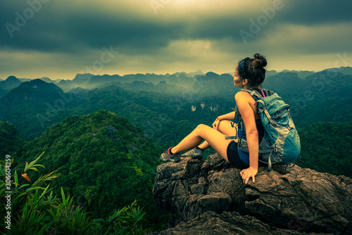 Cat Ba National Park Top of the Hill Young Woman enjoys beautiful view from the Ngu Lam peak in Kim Giao forest,