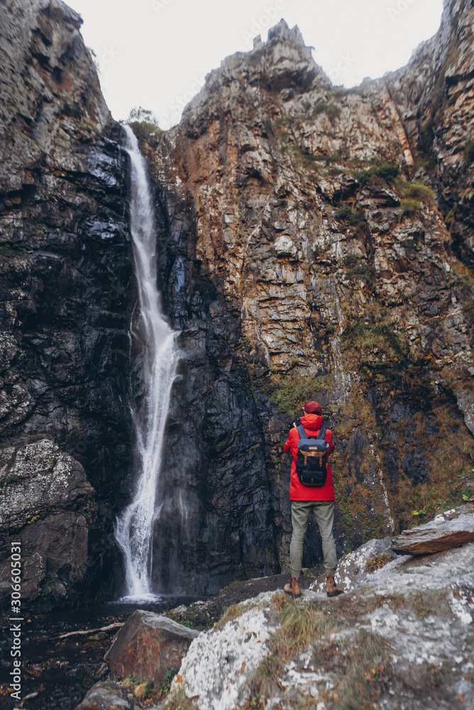 Bearded Travel photographer man taking nature photo or video of mountain landscape in Georgia