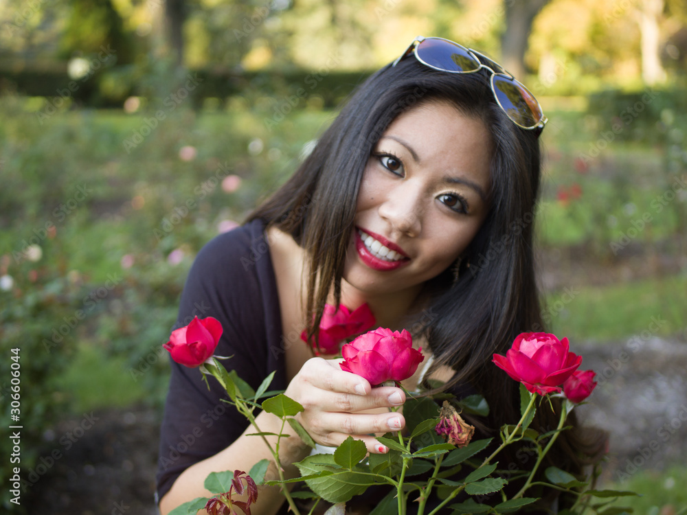 girl smiling with flower head tilted girl smiling with flower head tilted