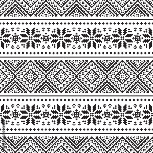 Knitted Christmas Ethnic pattern on white background. Ornament. Border. Seamless sample. It can be used as a background. Vector illustration.