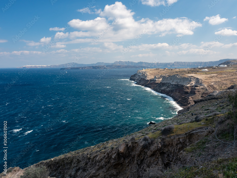 Santorini Island Rock Shore Sunny sky clouds Sea Santorini Island Rock Shore Sunny sky clouds Sea