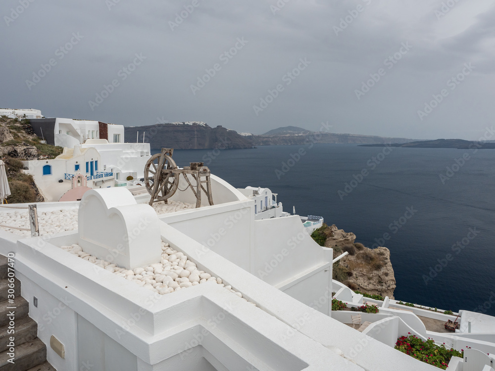 Obraz premium Santorini Island White Buildings Mill Sea Clouds