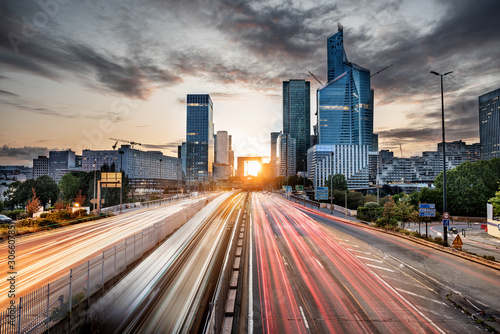 Fototapeta Naklejka Na Ścianę i Meble -  La Defense district skyline taken at the sunset with skyscraper and the rush hour traffic, Paris, France