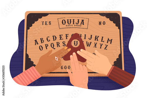 Ouija board. Communicating with ghosts. People conducting a seance using a spiritual board. Top view photo