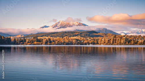 Snow capped Mt Maude reflecting on Lake Wanaka at sunset on a clear winter day, South Island, New Zealand