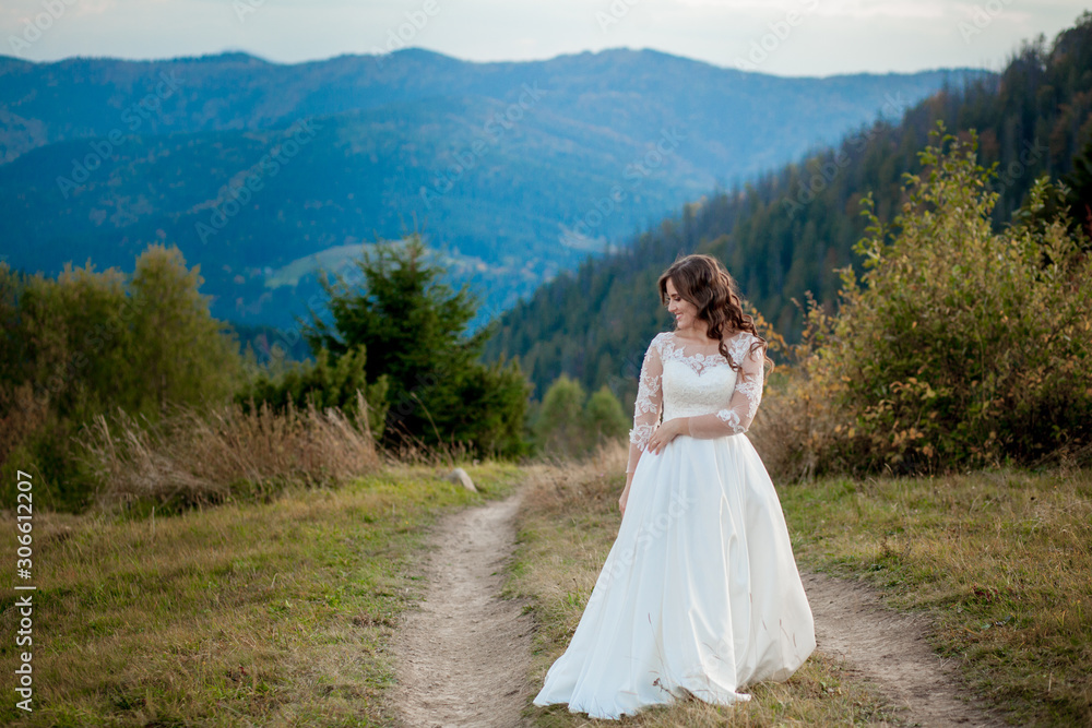 Bride in the mountains. The concept of lifestyle and wedding