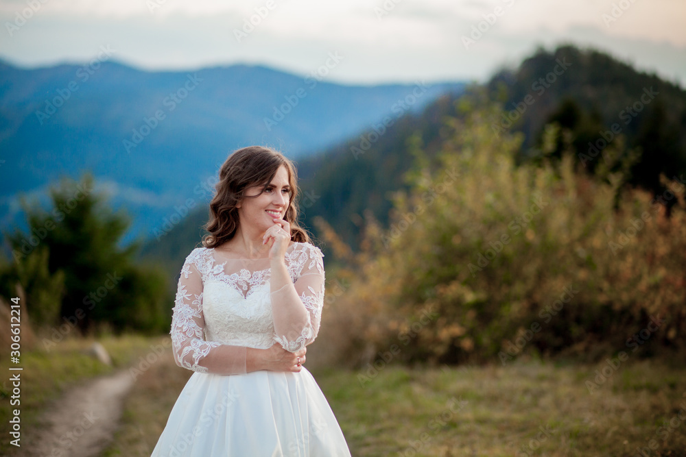 Bride in the mountains. The concept of lifestyle and wedding Bride in the mountains. The concept of lifestyle and wedding
