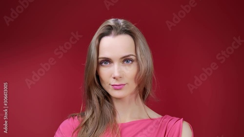 Wallpaper Mural Close-up portrait of seductive young blonde girl posing at red studio background zoom in Torontodigital.ca