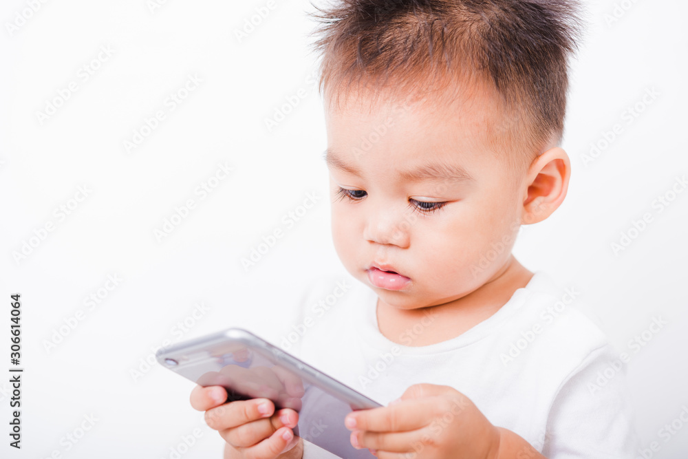 Asian portrait child boys 1 year 6 months holding smartphone Asian portrait child boys 1 year 6 months holding smartphone