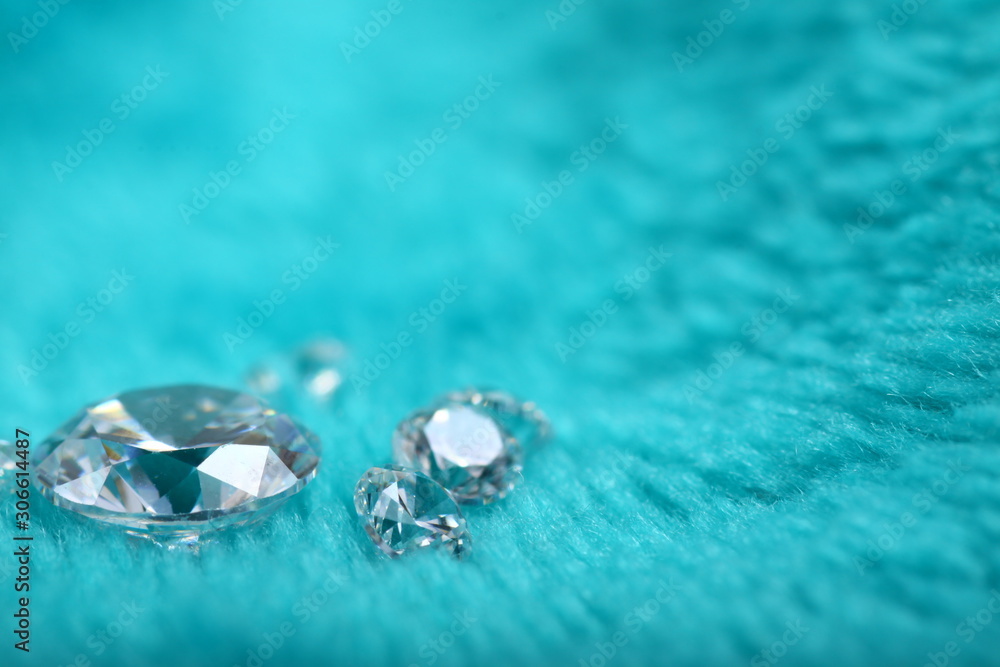 Close up shoot of diamonds on a green furry fabric as a backgound Close up shoot of diamonds on a green furry fabric as a backgound