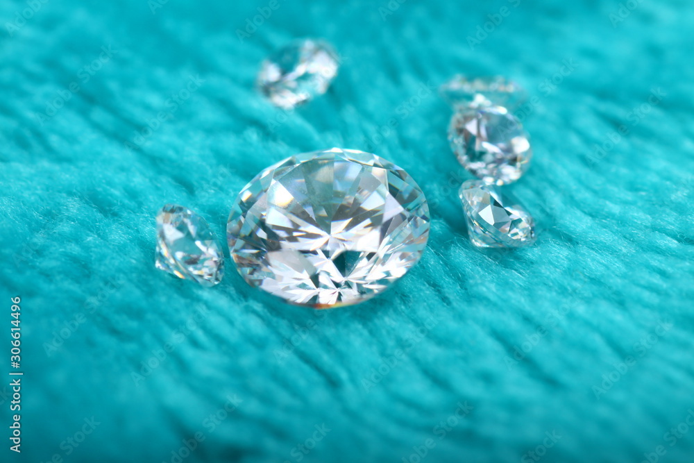 Close up shoot of diamonds on a green furry fabric as a backgound Close up shoot of diamonds on a green furry fabric as a backgound
