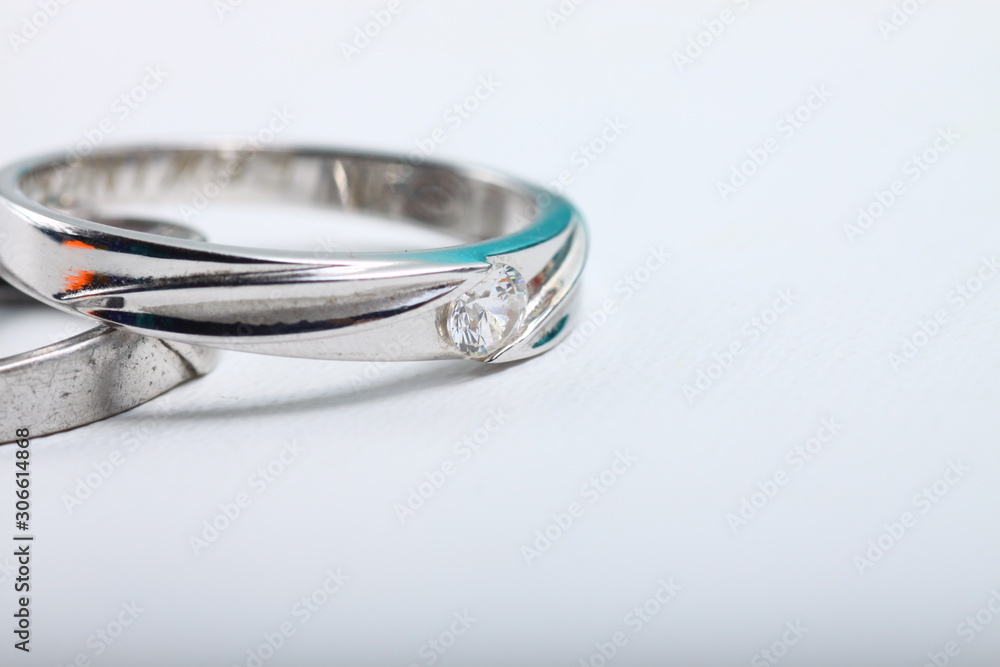 Close up shoot of an white gold engagement ring with diamonds on an isolated white background Close up shoot of an white gold engagement ring with diamonds on an isolated white background