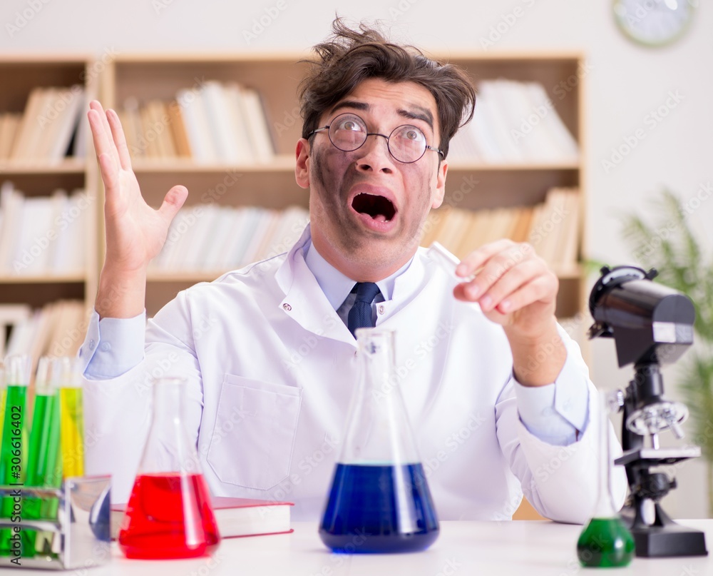 Mad crazy scientist doctor doing experiments in a laboratory Mad crazy scientist doctor doing experiments in a laboratory