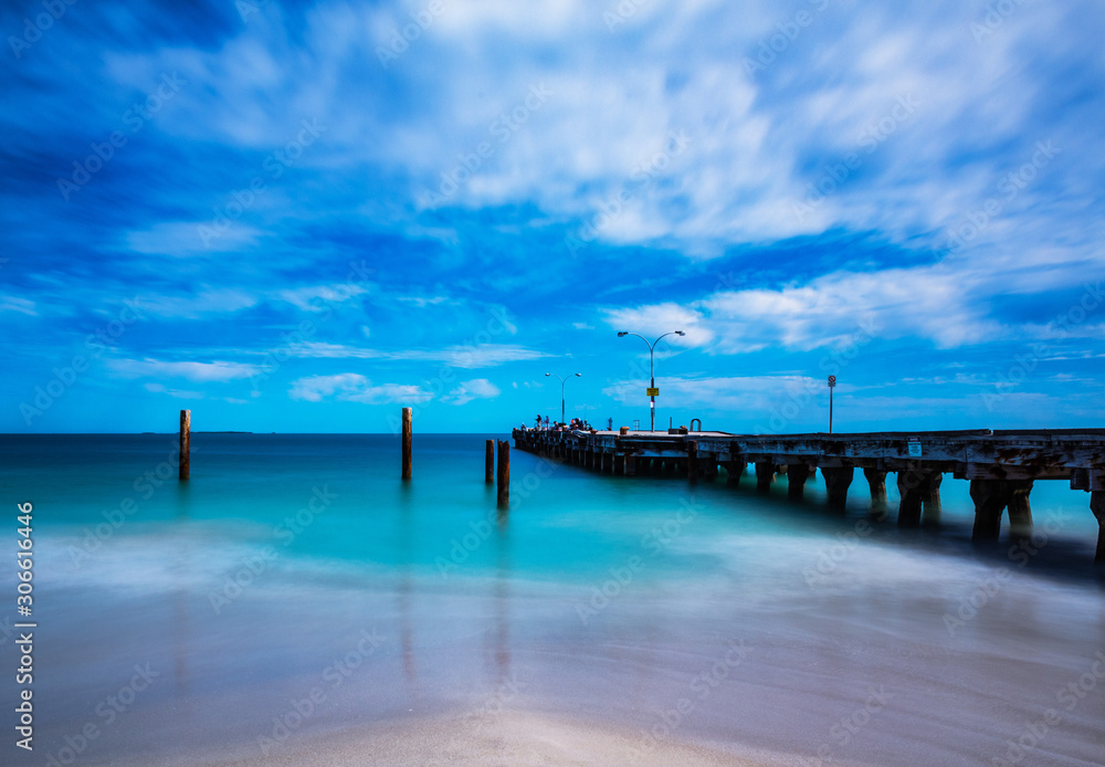 Pier over sea, long exposure, fishing, blue sky, moving water