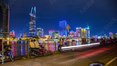 Lovers watching Ho Chi Minh City waterfront at night, Vietnam time lapse photo