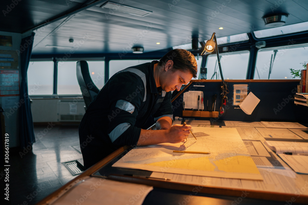 Marine navigational officer during navigational watch on Bridge . He
