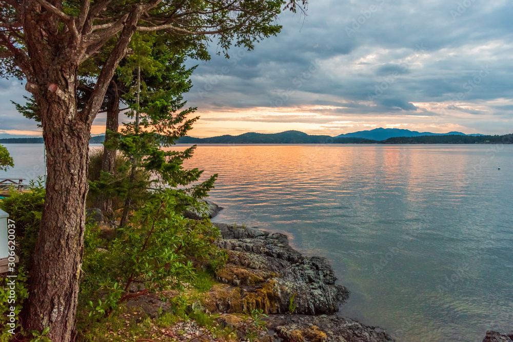 View of ocean sunset over mountains in beautiful British Columbia. Canada. View of ocean sunset over mountains in beautiful British Columbia. Canada.