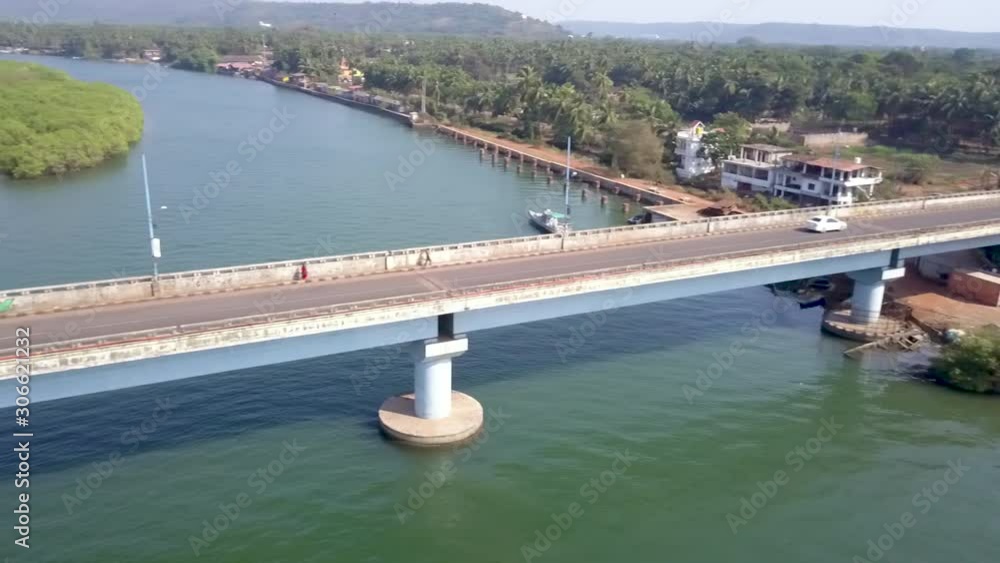 Pan drone shot of Siolim bridge in Goa, India. Pan drone shot of Siolim bridge in Goa, India.
