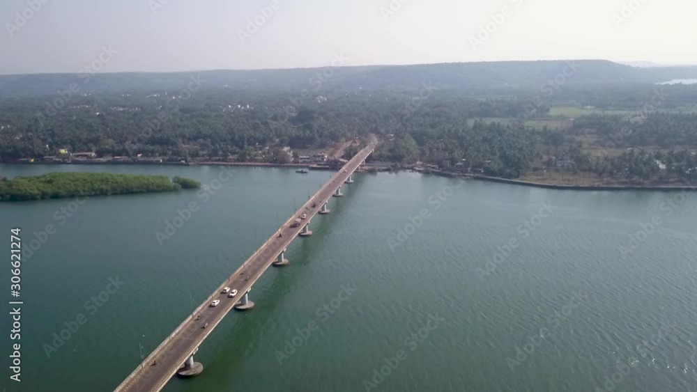 Drone shot flying over the Siolim bridge, Goa, India Drone shot flying over the Siolim bridge, Goa, India