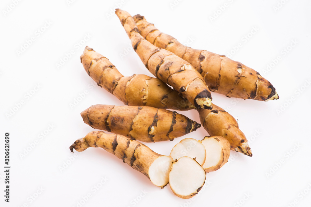 Raw Whole Jerusalem artichokes on a white background Raw Whole Jerusalem artichokes on a white background