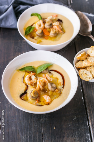 Two spoon of vegetables soup made of prawns and mushrooms. Healthy and Low-Calorie Seafood Recipes. Vertical shot