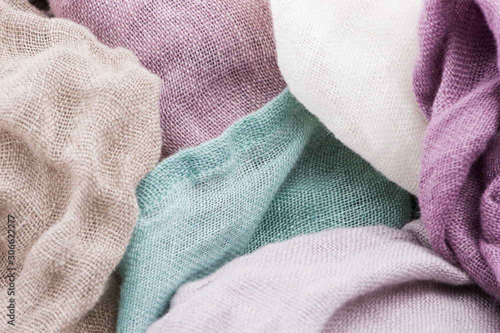 Fototapeta premium Multicolored textile with violet tones and colorful accents and rich, detailed texture, flax