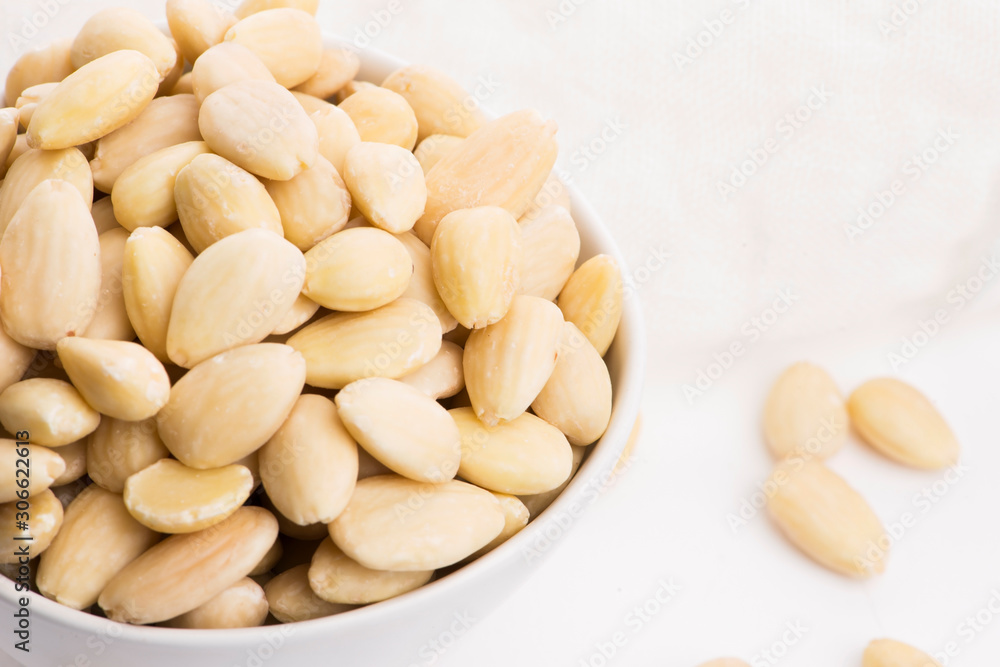 Bowl of almonds on a white background Bowl of almonds on a white background