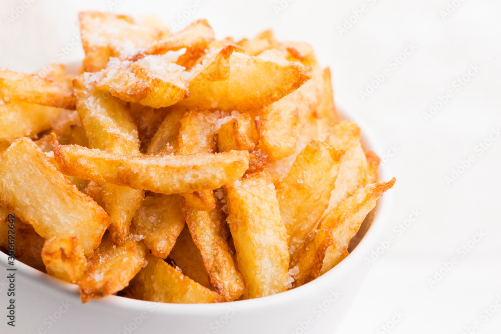 Bowl of potatoe fries on a white background Bowl of potatoe fries on a white background