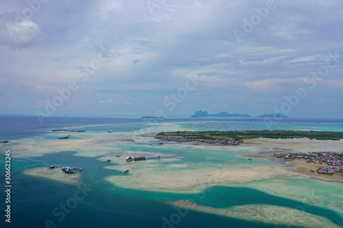 Fototapeta Naklejka Na Ścianę i Meble -  Aerial view partial part of Semporna island with blue ocean and coral reef in Malaysia, Borneo.